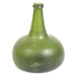 An 18thC green onion shaped glass wine bottle, with a tapering neck, 18cm high. Reports are no