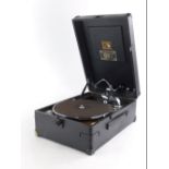 A HMV portable gramophone, in black canvas with metal and chrome plated mounts.