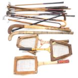 A quantity of hickory and other wooden shafted golf clubs, two hockey sticks, and various tennis