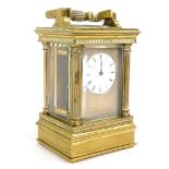A late 19th/early 20thC French miniature carriage clock, with engine turned decoration,