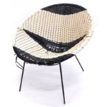 A 1950s/60s woven chair, in black and white with ebonised metal base, possibly Conran.