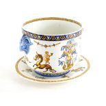 A Gien faience pottery jardiniere, decorated with putti, mythical creatures, etc., and a matching