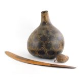 Tribal Art. A geometrically decorated large gourd, 46cm high, another smaller example and a