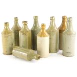 A collection of stoneware, mainly beer bottles, stamps to include C.Bell, Lincoln, Harrison,