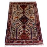 An Indian rug, with an all over design of animals, to include lions, cat like animals, birds,