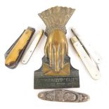 A Victorian Kingsgryp letter clip modelled in the form of a hand, and various pen knives to