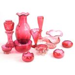 A collection of Victorian and later cranberry tinted glass, to include a vase modelled as a