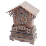 A late 19th/early 20thC Black Forest cuckoo mantel clock, with carved oak Gothic style case (AF),