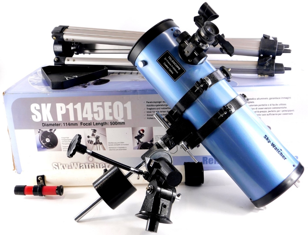 A Sky Watcher Reflector telescope, number SKP1145EQ1, in pale purple with tripod, original box,