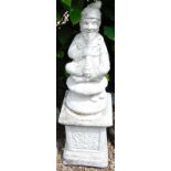 A composition figure of a gnome smoking a pipe, on a rectangular plinth, 107cm high overall.