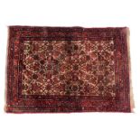 A Persian Kayam type rug, with an all over design, on a red ground, 105cm x 145cm.