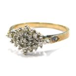 A 9ct gold multi stone dress ring, set in a cluster with tiny white stones, each claw set with