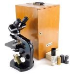 A Nikon Stereo microscope, with various extra lenses, etc., numbered 92642, in a fitted case.