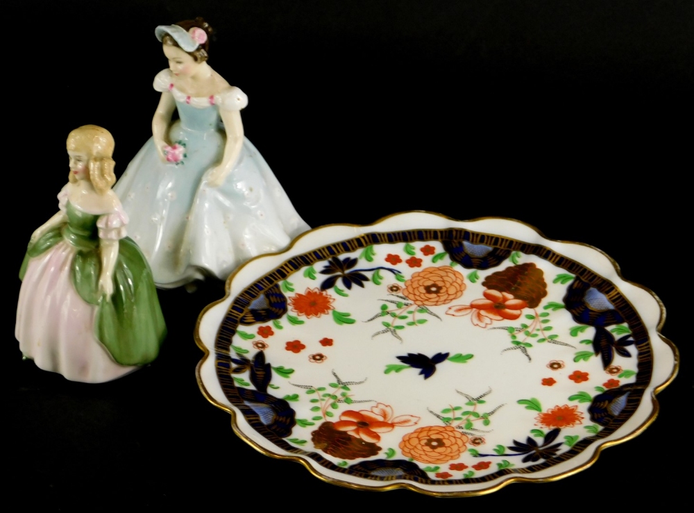 Two Royal Doulton figures of Penny and The Bridesmaid, and a Shelley Imari patterned plate decorated