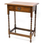 An oak side table, the top with a moulded edge, above a frieze drawer, on bobbin turned legs, 61cm