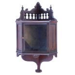 An Edwardian mahogany and boxwood strung corner cabinet, with single glazed door, 61cm high, 33cm