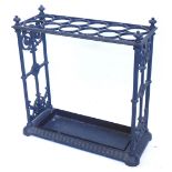 A Victorian style cast iron umbrella stand, with divisions for twelve umbrellas, walking sticks,