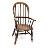A 19thC ash and elm child's Windsor chair, with spindle turned supports on turned legs with H