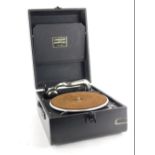 A Linguaphone portable gramophone, in black canvas case with chrome plated mounts.