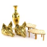 A pair of cast brass fox head door stops, a pair of pierced trivets and a vase. (5)