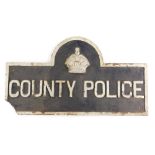 A cast iron plaque for County Police, decorated with a crown, etc., 35cm high, 63cm wide. (AF)