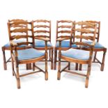 A set of six oak ladder back chairs, each with a drop in seat, on part turned supports.