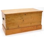 A stripped pine blanket box, on a plinth base, 92cm wide.