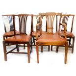 A set of four mahogany dining chairs in George III style, each with a pierced splat and a drop in