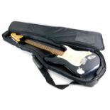 A Squier Strat by Fender electric guitar in black, 100cm long, with canvas case.