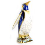 A Royal Crown Derby porcelain paperweight, modelled in the form of an Emperor penguin, gold button