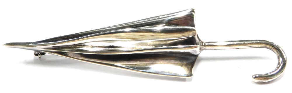 A silver umbrella brooch, with single pin back, maker JS, Sheffield 1999, 7cm long, 13g all in.