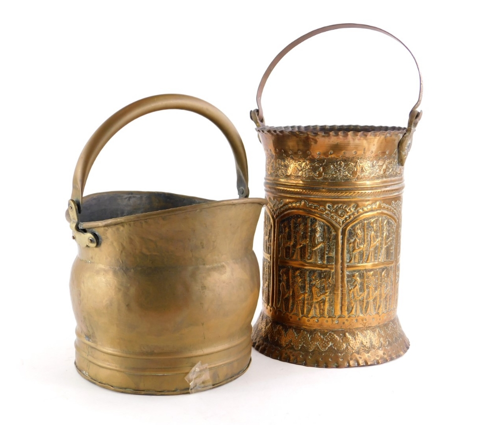 A continental embossed copper coal bucket, with loop handle, 50cm high, and a brass coal bucket. (