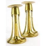 A pair of late 19thC brass secessionist design candlesticks, of tapering form, 14cm high.