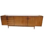 A 1960's teak sideboard, possibly Kefod Larsson for G-plan, with five graduated drawers, and two