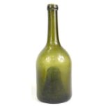 A late 18th/early 19thC green glass wine bottle, with deep indent to underside, 26cm high. Reports