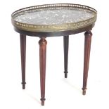 A French stained beech occasional table, the oval top with a grey marble insert and a pierced