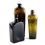 A 19thC green glass whisky bottles for Ainslie's, P.Loopuyt and Co., and J.T.Beukers.