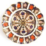 A Royal Crown Derby porcelain plate, with a petalated border, decorated with the 1128 Imari pattern,