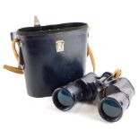 A pair of Russian 7x50 binoculars, in blackened metal, with black grips, sold with instructions in