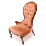 A stained beech nursing chair in Victorian style, with a button padded back, padded seat on cabriole