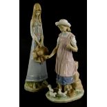 A Lladro porcelain figure of a young girl feeding doves, (AF), 28cm high, and a Spanish porcelain