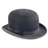 A Dunn and Co bowler hat, label to inside, numbered 400, 758.