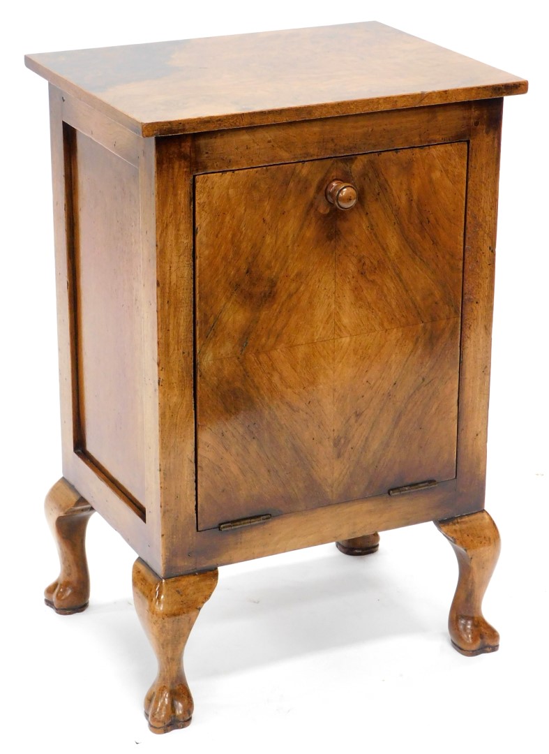 A figured walnut coal purdonium, the rectangular top above a fall front drawer with zinc lined