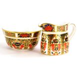 A miniature Royal Crown Derby porcelain 1128 Imari pattern milk jug, and sugar bowl.