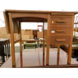 A mid 20thC oak office desk, the top with a foldover flap and three side drawers.