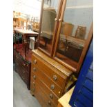 A collection of furniture, to include an oak chest of five long drawers, a glazed front display