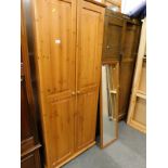 A pine double wardrobe, an oak double double wardrobe and a stool.