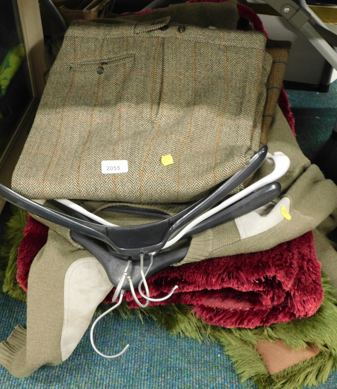 A quantity of clothing, to include gent's tweed trousers, gent's jumper, two rugs.