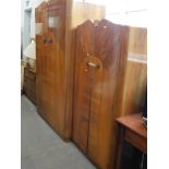 A mid 20thC part bedroom suite, to include mirror backed dressing table, double wardrobe, etc. (a