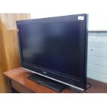 A Sony Bravia 32 inch flat screen television, with lead and remote.